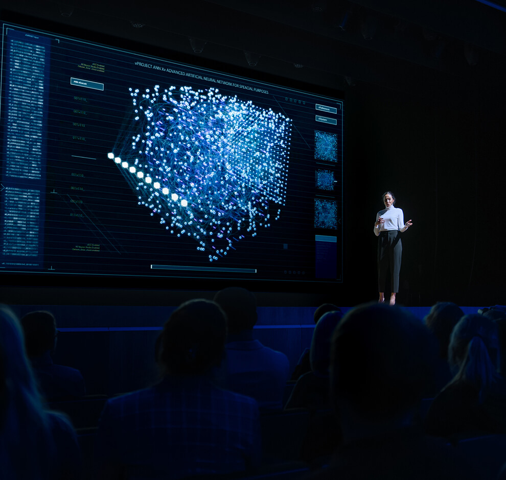 KT - A women presenting at a seminar