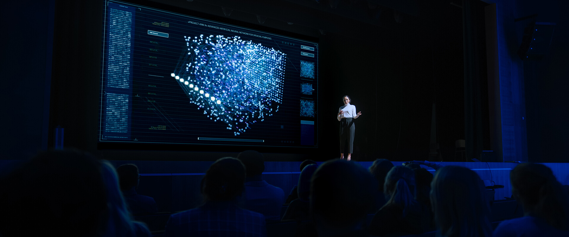 KT - A women presenting at a seminar