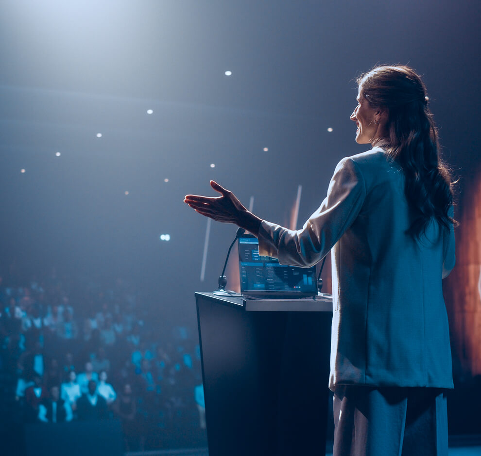 KT - Close up of a women presenting at a congress event