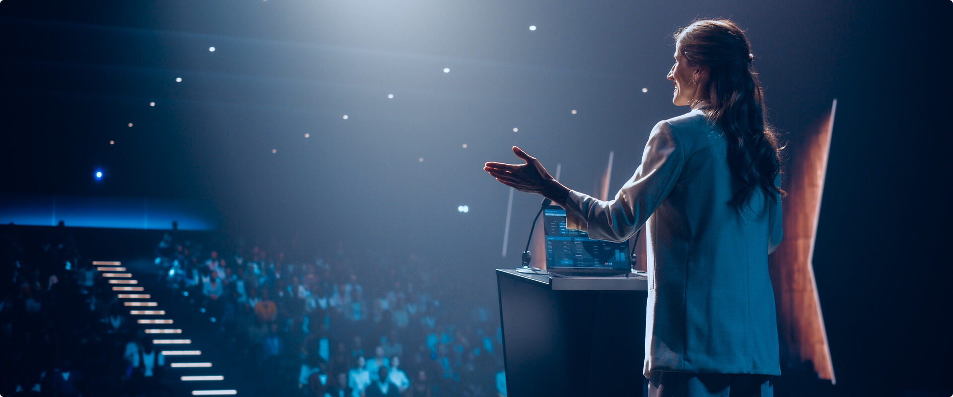 KT - Close up of a women presenting at a congress event