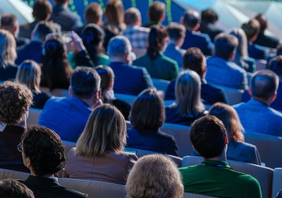 KT - Audience listening to speech