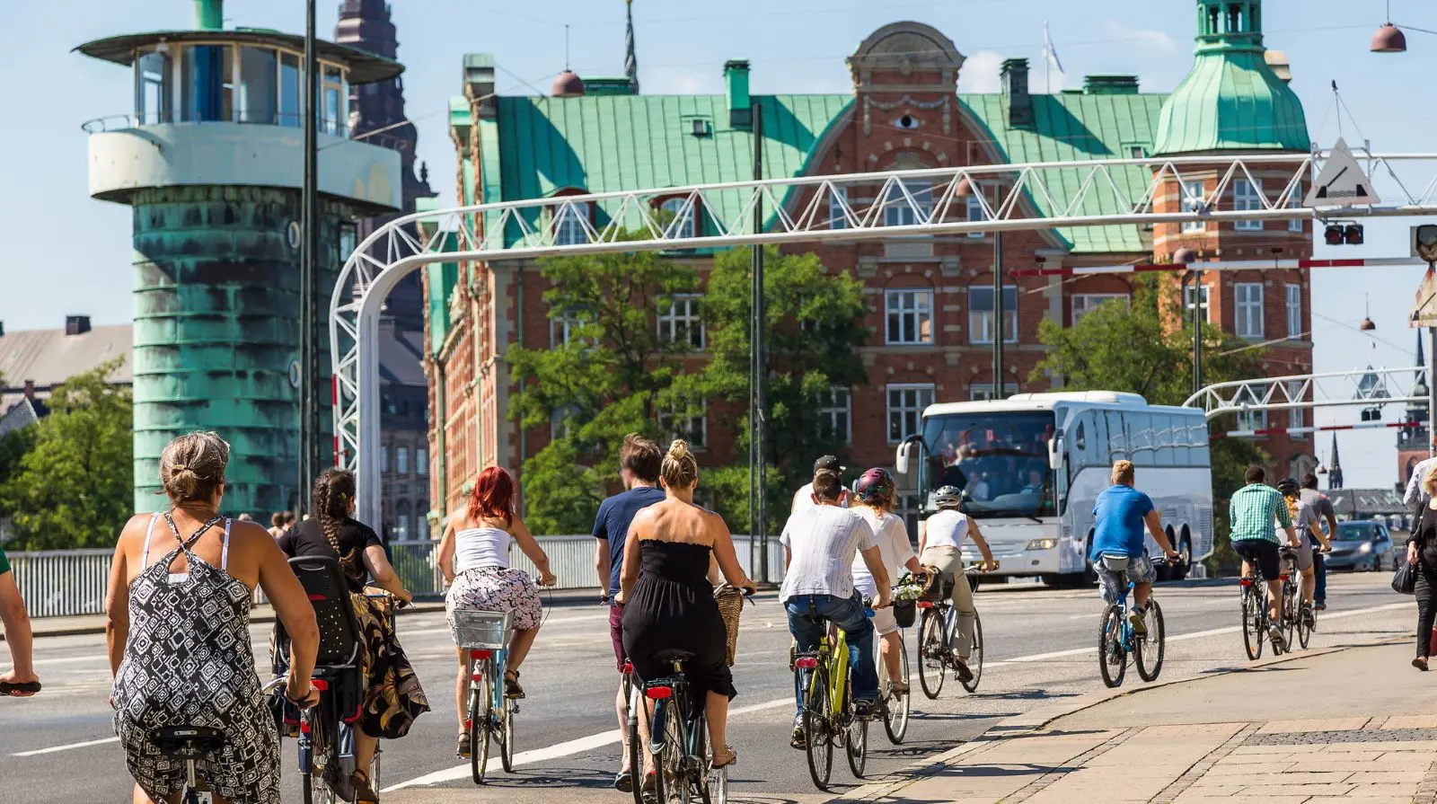 Cyclists crossing a bridge in Copenhagen, showcasing the city’s strong cycling culture and sustainable transport infrastructure.