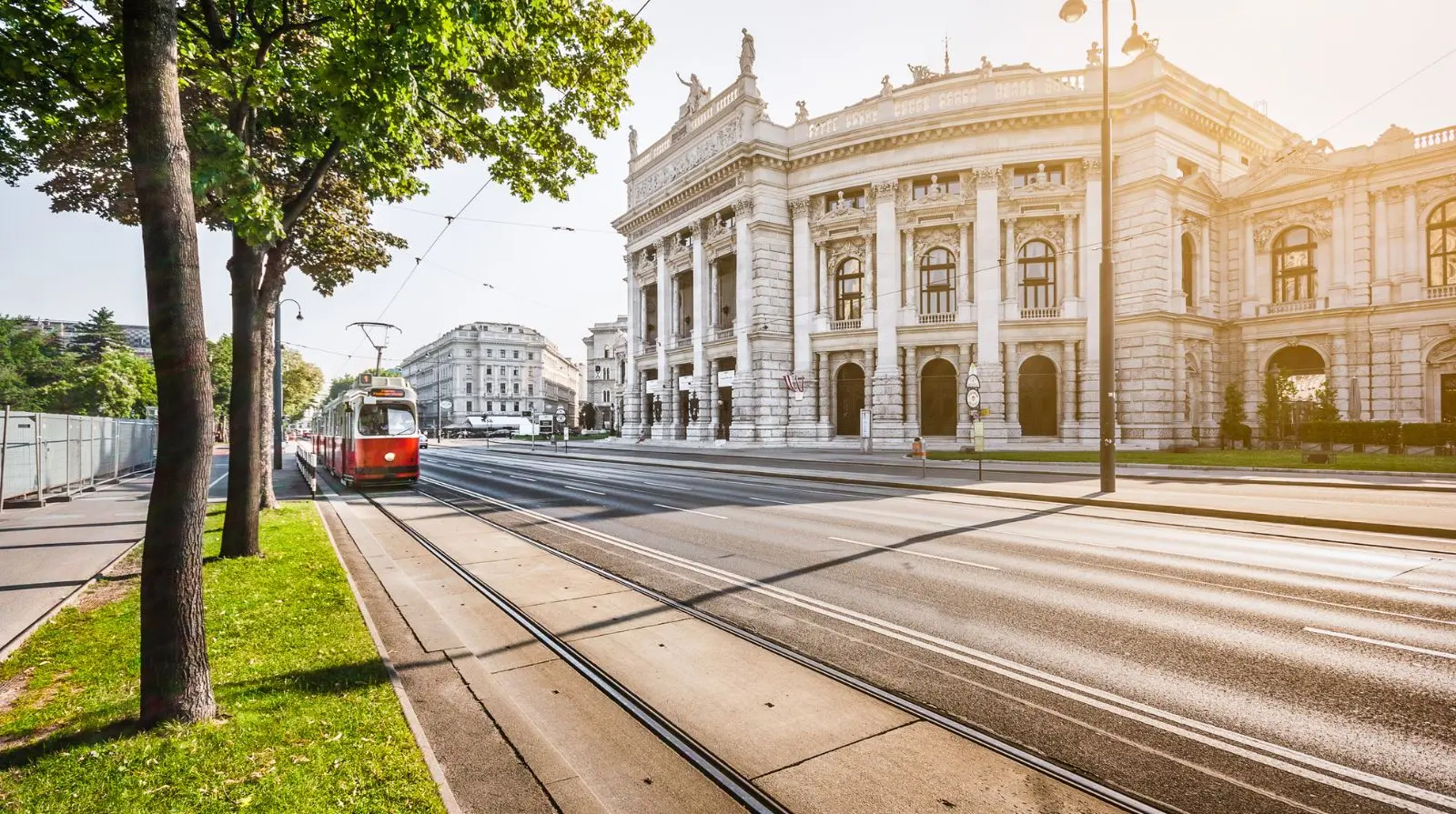 Tram passing the Vienna State Opera in Vienna, demonstrating the city’s efficient and sustainable public transport system.