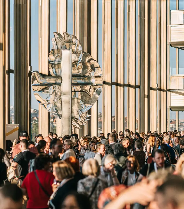 Delegates networking at the European Astronomical Society Congress in a modern glass venue