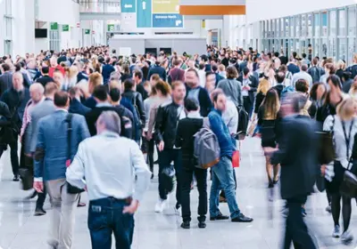 Large exhibition hall with attendees networking at a congress