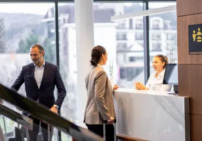 Business professionals discussing accommodation strategy in an office meeting