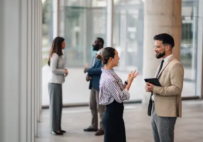 Business professionals networking and discussing partnership opportunities