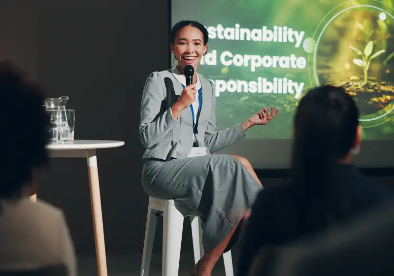 Speaker presenting sustainability and corporate responsibility at a conference