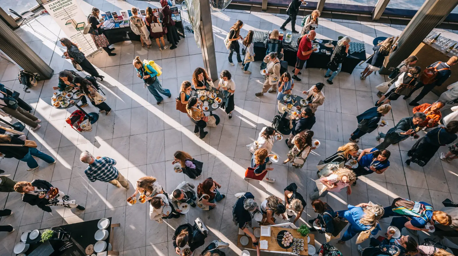 Aerial view of delegates seated at tables during the EMDR Europe Research & Practice Conference 2025