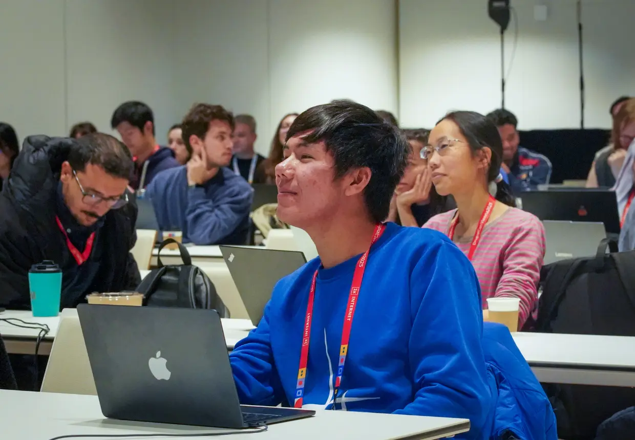 elegates attend a session at DrupalCon Europe 2025, part of the community programme that includes newcomer workshops, grants, and inclusion scholarships.