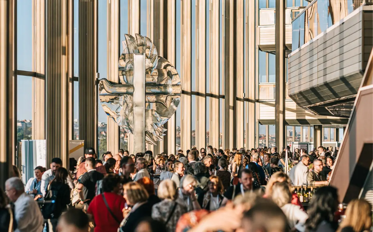 Delegates networking at the European Astronomical Society Congress in a modern glass venue