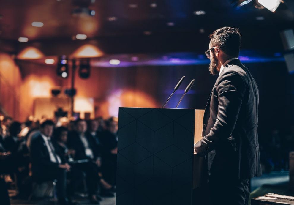 KT - Men doing a speech