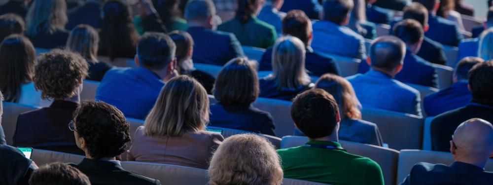 KT - Audience listening to speech