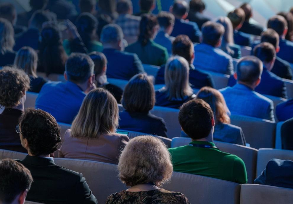 KT - Audience listening to speech